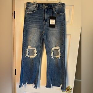 New with tags. Risen women’s Distressed Blue Jeans. Size 13/31.